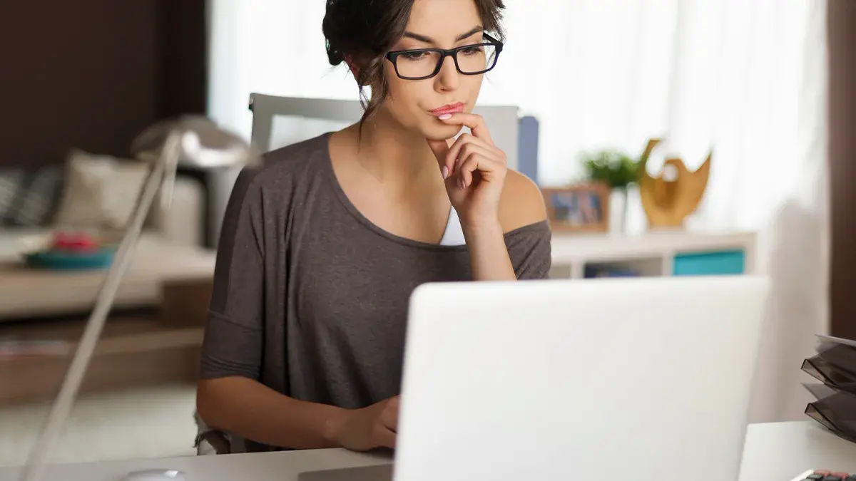 Woman working on laptop from home